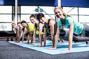 Fit women doing plank exercises