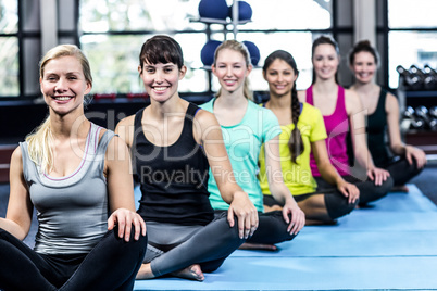 Fitness class doing yoga exercises