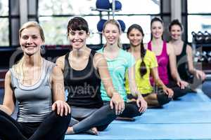 Fitness class doing yoga exercises