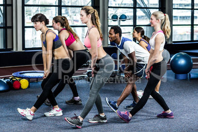 Fit smiling group doing exercise