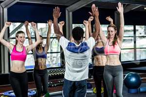 Fit smiling group doing yoga