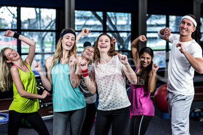 Fit group dancing and smiling