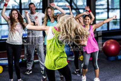Fit group exercising and smiling