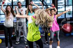 Fit group exercising and smiling