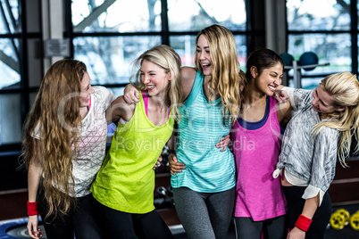 Fit group posing and smiling