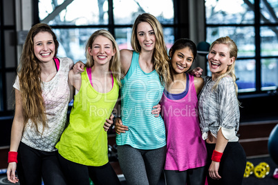 Fit group posing and smiling