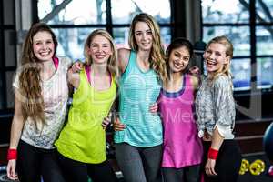 Fit group posing and smiling