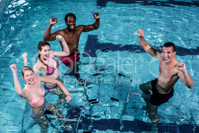 Fit people doing an aqua aerobics class