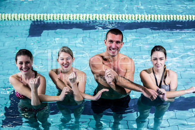 Fitness group doing aqua aerobics