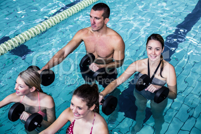 Fit people doing an aqua aerobics class