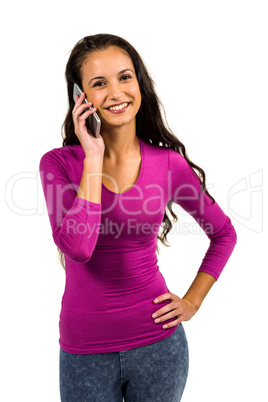 Smiling woman on a phone call looking at the camera