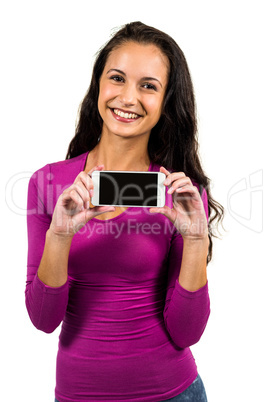 Smiling woman showing smartphone screen at the camera