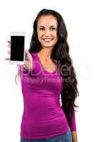 Smiling woman showing smartphone screen at the camera