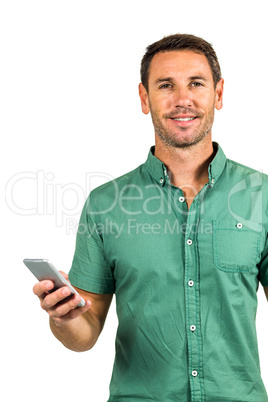 Smiling man holding smartphone and looking at the camera