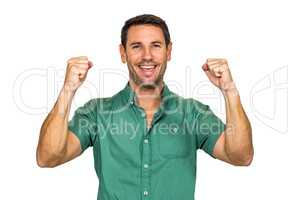 Happy man rejoicing raising fists