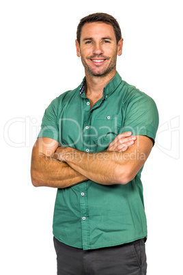 Smiling man with arms crossed