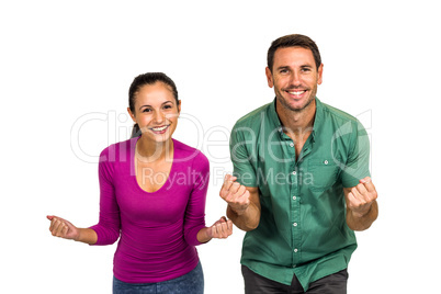 Triumphant couple raising fists