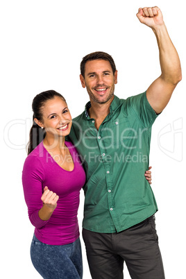 Triumphant couple raising fists