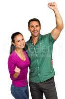 Triumphant couple raising fists