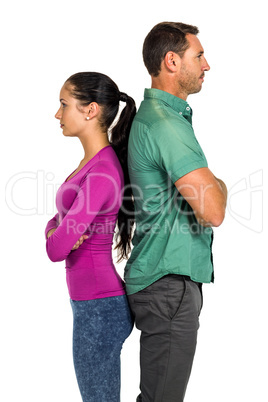 Couple standing back to back