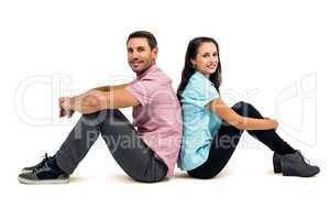 Portrait of couple sitting back to back