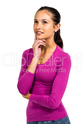 Thoughtful smiling woman with finger on mouth