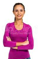 Smiling woman with arms crossed looking at camera