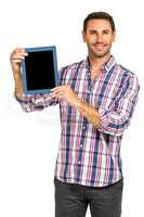 Smiling man showing tablet screen at camera