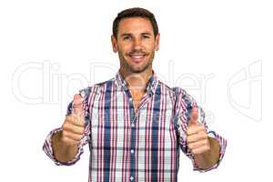 Smiling man showing thumbs up at camera