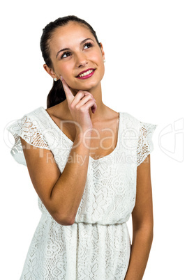 Young thoughtful woman with finger on cheek