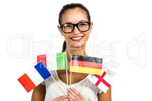 Young woman with eyeglasses holding flags