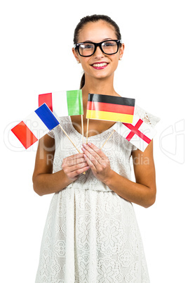 Smiling woman with eyeglasses holding flags
