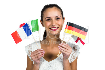Confident woman holding flags