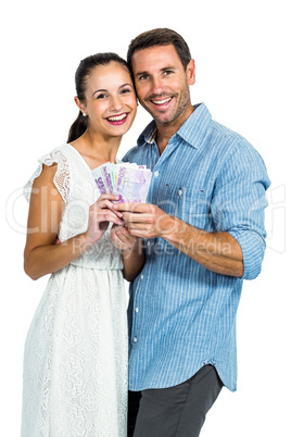 Happy couple holding money