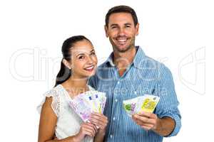 Young couple holding money