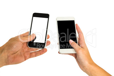 Hands holding smartphones