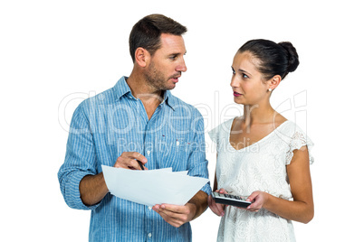 Worried couple calculating bills