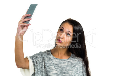 Facing woman taking selfie