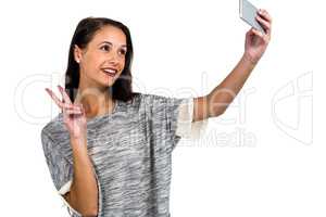 Smiling woman taking selfie