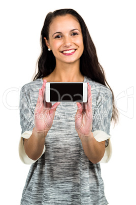 Young happy woman showing smartphone screen at camera