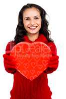 Smiling woman holding heart shape box
