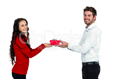 Young couple holding gift box