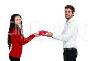 Young couple holding gift box