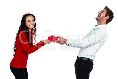 Happy young couple holding gift box