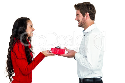 Excited young couple holding gift box