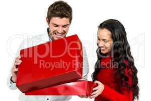Smiling couple opening gift box