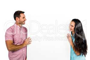 Young couple holding white sheet