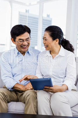 Smiling man at home on couch