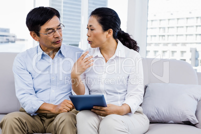 Smiling man at home on couch