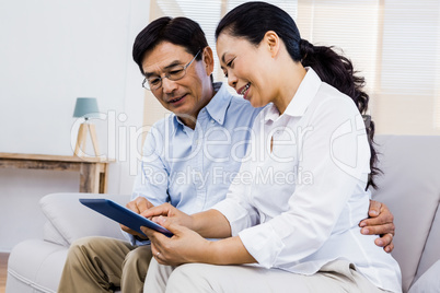 Smiling man at home on couch